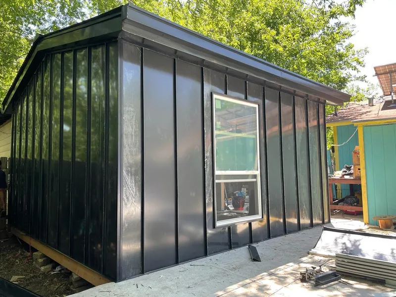 Black standing seam metal wall panels for Roof Inspection in Leander