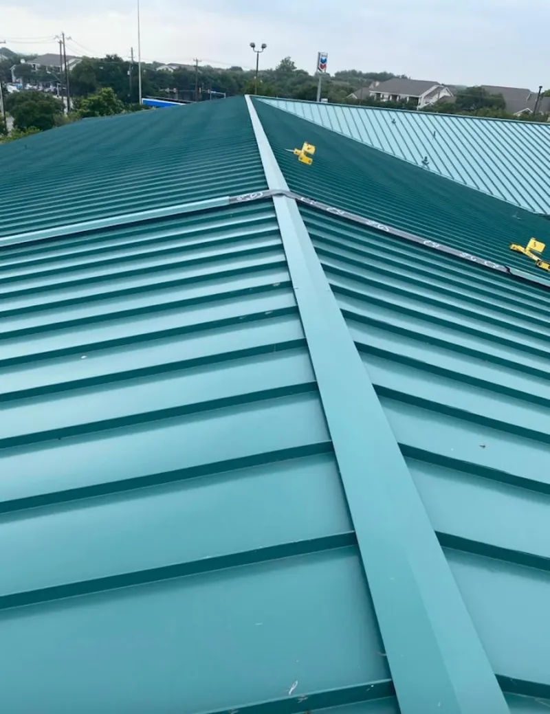 Green commercial metal roof ridge and valley for Metal Roof Repair in Leander